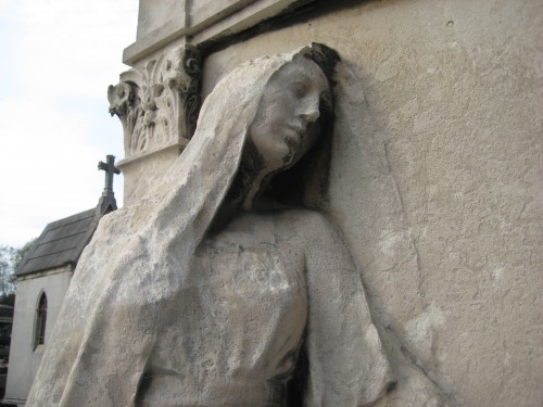 Closeup of woman and door - Père Lachaise Cemetery, Paris