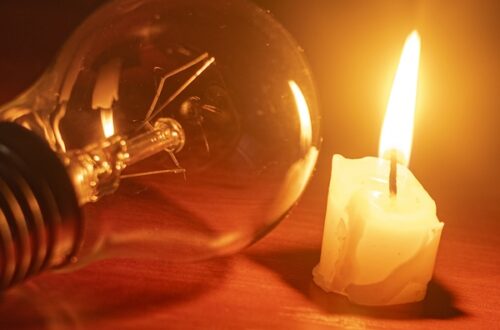 lit candle dead lightbulb