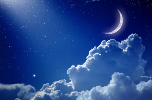 Night sky, with Cheshire cat moon and clouds